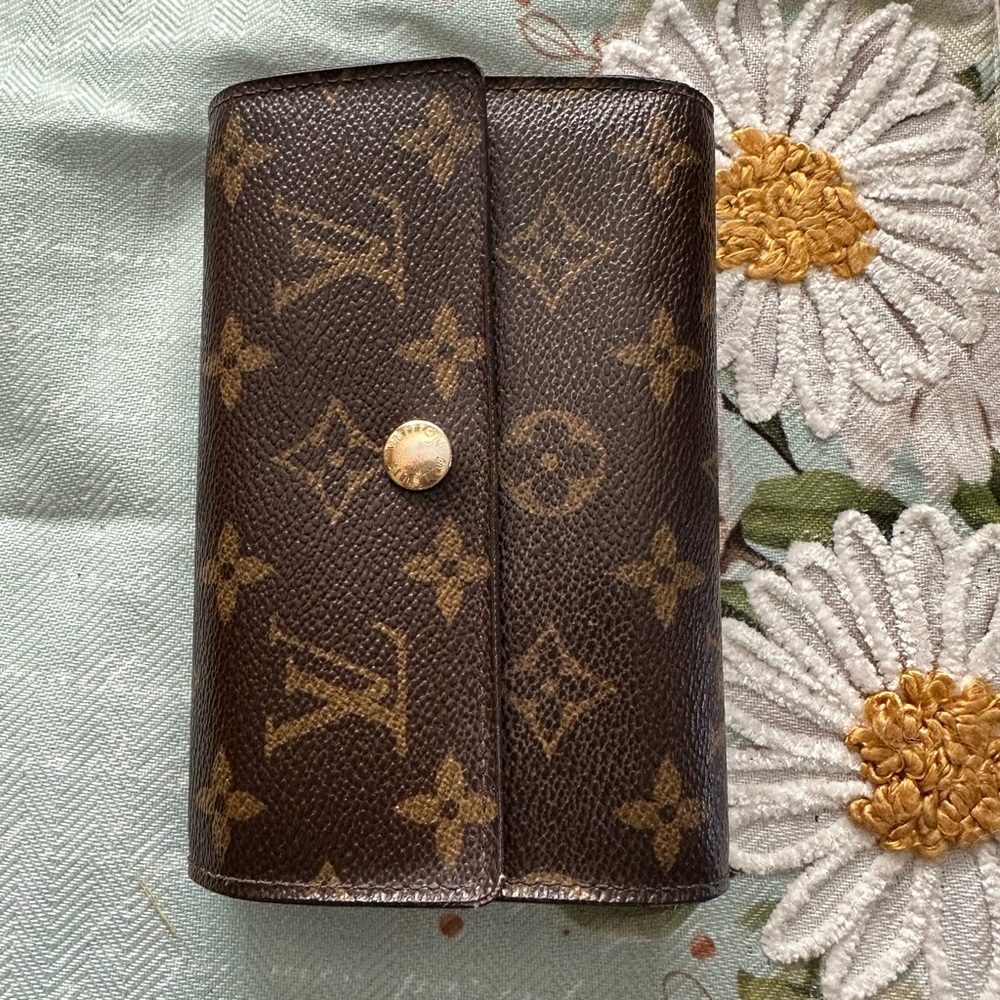 Vintage Louis Vuitton wallet. Used condition with signs of wear.